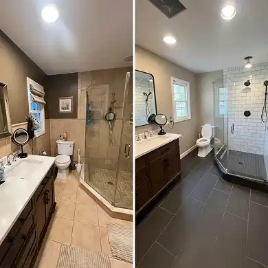 A side-by-side comparison of a primary bathroom remodel showing a dated tan-tiled space being updated with large-format charcoal floor tiles, a white subway-tiled walk-in shower with black hardware, and a modern wood vanity.